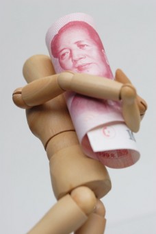 木偶人抱着人民币图片
